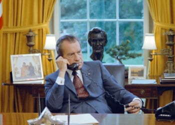 President Richard Nixon talks on the telephone at his desk in the White House's Oval Office, Washington, D.C., on June 23, 1972.