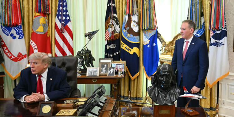 The Administrator of the US Environmental Protection Agency Lee Zeldin (R) looks on as US President Donald Trump speaks after signing a presidential memo on pollution control in vehicles at the Oval Office of the White House in Washington, DC, on June 29, 2026.