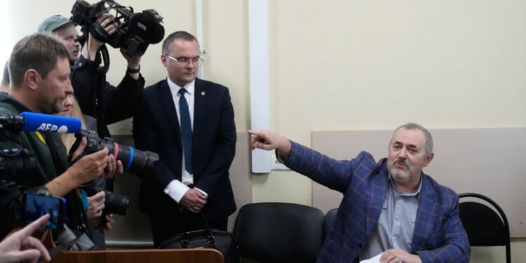 A Putin critic leaves Russia after he is barred him from running for parliament