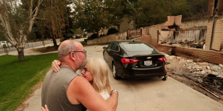 Washington state fires destroy hundreds of structures and force Spokane-area residents to evacuate