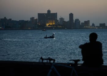 Cubans sleep on seaside boardwalk to seek relief from crippling blackouts and summer heat