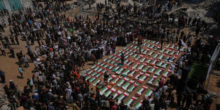Palestinians hold mass funeral for 112 bodies finally recovered from a 2023 Gaza strike