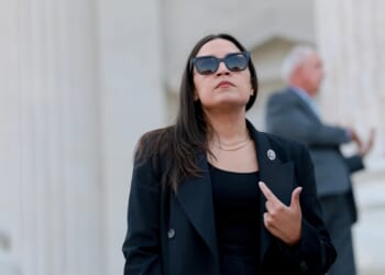 Rep. Alexandria Ocasio-Cortez speaks to reporters on the House steps after a series of votes at the U.S. Capitol on July 22, 2026, in Washington, D.C.