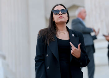 Rep. Alexandria Ocasio-Cortez (D-NY) speaks to reporters on the House steps after a series of votes at the U.S. Capitol on July 22, 2026 in Washington, DC. The House of Representatives passed legislation funding for the 2027 NDAA defense programs and banned insider stock trading among lawmakers. (Photo by Anna Moneymaker/Getty Images)