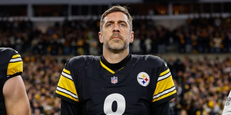 Aaron Rodgers of the Pittsburgh Steelers stands for the national anthem prior to the AFC Wild Card playoff game against the Houston Texans at Acrisure Stadium on Jan. 12, 2026, in Pittsburgh, Pennsylvania.