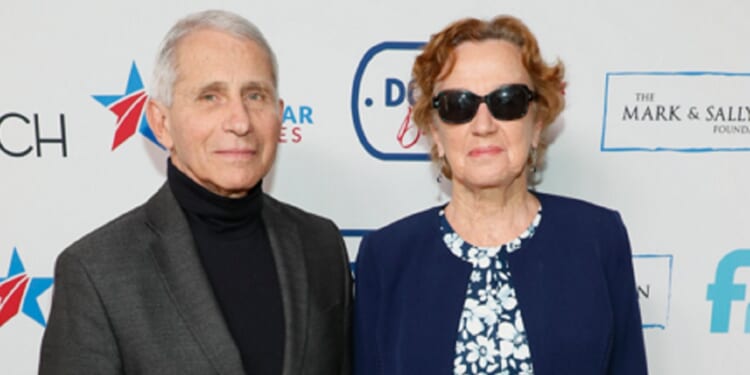 Dr. Anthony Fauci and his wife, Christine Grady, are pictured in a file photo from the 27th Annual White House Correspondents' Weekend Garden Brunch in April 2022 in Washington.