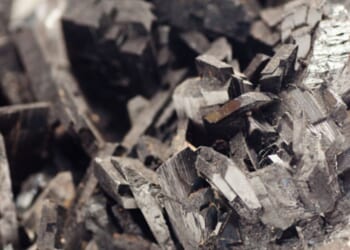 The metal substance Tungsten is pictured under light.