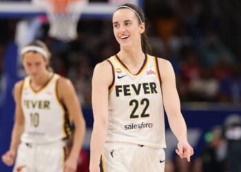 A pumped Caitlin Clark grins before Sunday's game against the WNBA's Chicago Sky at Chicago's Wintrust Arena.