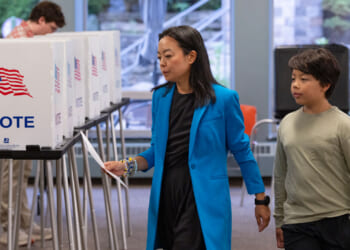 With her son George by her side, Democratic Wisconsin Gubernatorial candidate Francesca Hong votes in the primary election.