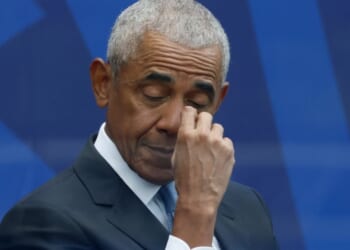 Former U.S. President Barack Obama listens to Michelle Obama's speech at the Barack Obama Presidential Center in John Lewis Plaza on June 18, 2026 in Chicago.