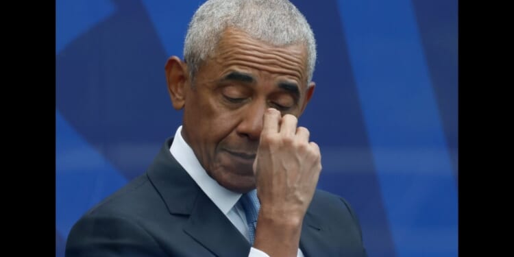 Former U.S. President Barack Obama listens to Michelle Obama's speech at the Barack Obama Presidential Center in John Lewis Plaza on June 18, 2026 in Chicago.