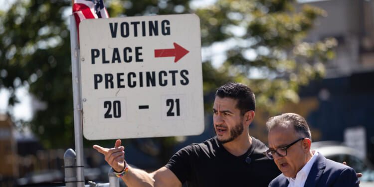 Democratic candidate for U.S. Senate in Michigan Abdul El-Sayed visits a polling place as residents cast their votes.