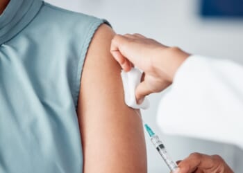 A patient receives a vaccine.