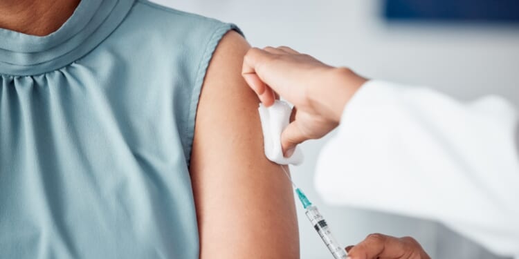 A patient receives a vaccine.