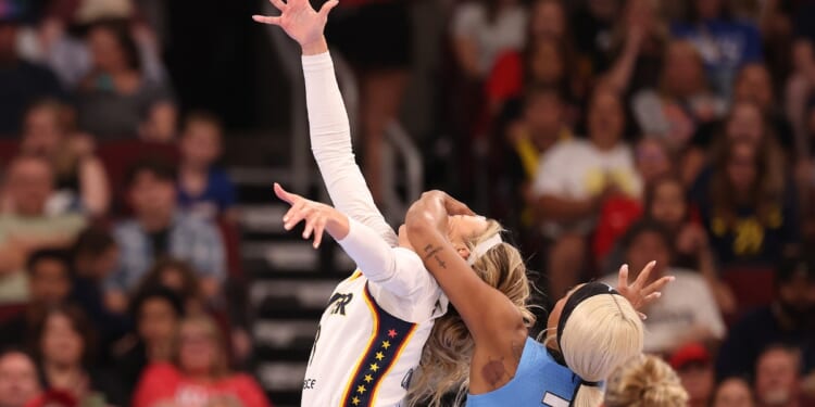 Sophie Cunningham of the Indiana Fever is fouled by DiJonai Carrington of the Chicago Sky during the first half at United Center on Aug. 8, 2026, in Chicago, Illinois.