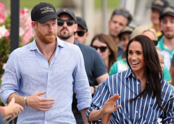 Prince Harry, Duke of Sussex, and Meghan, Duchess of Sussex greet members of the public at the Cruising Yacht Club of Australia on April 17, 2026, in Sydney, Australia.