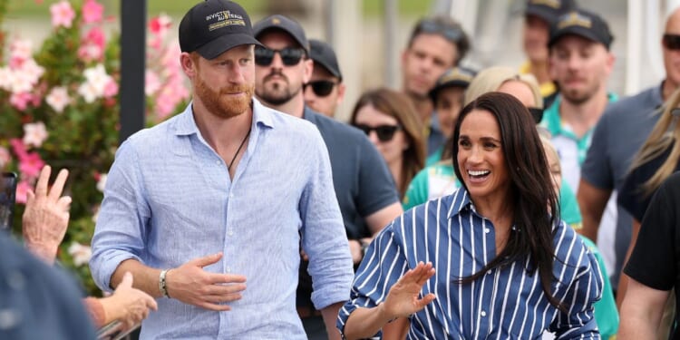 Prince Harry, Duke of Sussex, and Meghan, Duchess of Sussex greet members of the public at the Cruising Yacht Club of Australia on April 17, 2026, in Sydney, Australia.