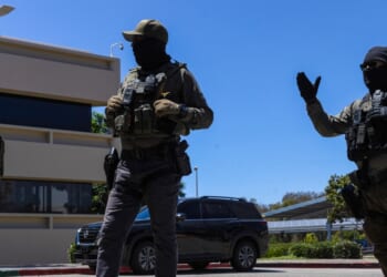 Immigration and Customs Enforcement agents stand guard outside the Ventura County Government Center in Ventura, California, on July 27, 2026.