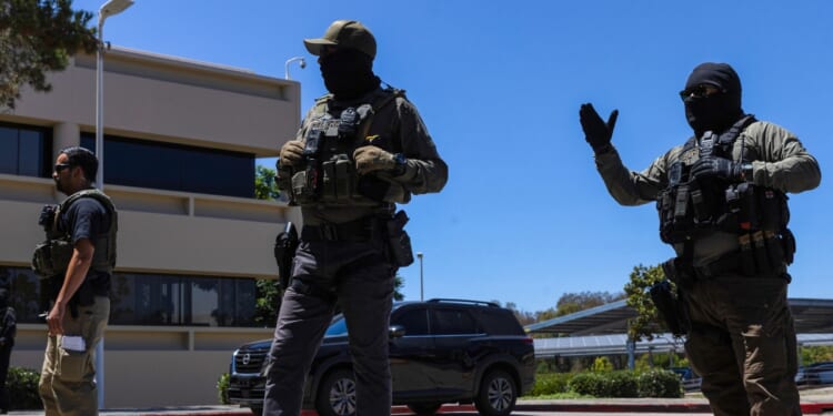 Immigration and Customs Enforcement agents stand guard outside the Ventura County Government Center in Ventura, California, on July 27, 2026.