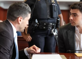 Luigi Mangione, right, attends a pre-trial appearance Tuesday in Manhattan Criminal Court in New York City.