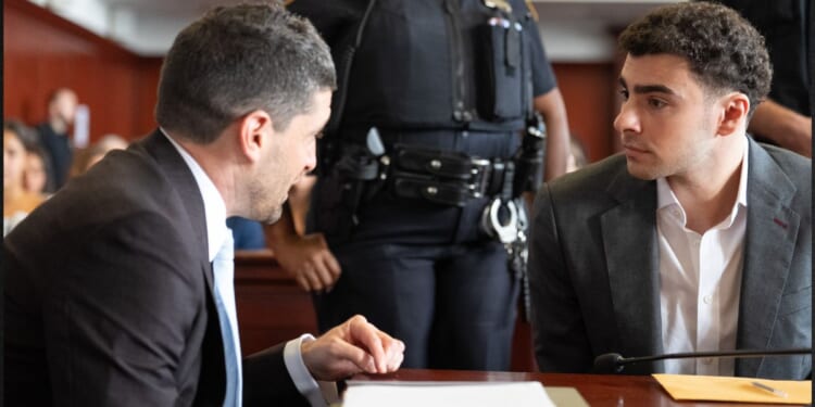 Luigi Mangione, right, attends a pre-trial appearance Tuesday in Manhattan Criminal Court in New York City.