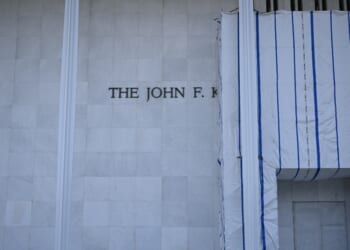 Scaffolding and a large protective tarp is covering part of the facade of the John F. Kennedy Center for the Performing Arts in Washington, D.C., on Aug. 13, 2026.