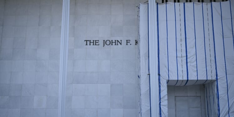 Scaffolding and a large protective tarp is covering part of the facade of the John F. Kennedy Center for the Performing Arts in Washington, D.C., on Aug. 13, 2026.