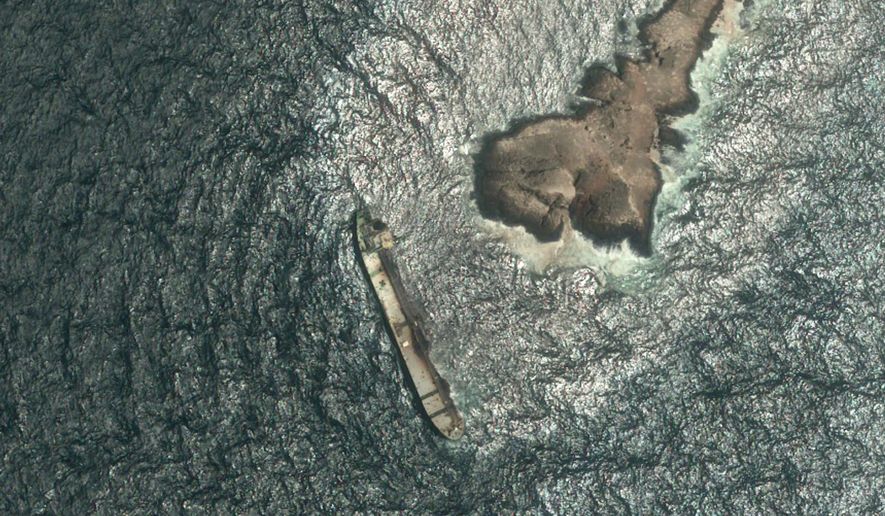 This satellite photo taken Wednesday Aug. 5, 2026, shows the tanker Caroline Bezengi, grounded and partly submerged off the coast of Oman, leaking crude oil into the sea. (Pléiades © CNES 2026, Distribution Airbus DS via AP)