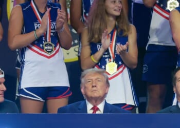 President Donald Trump sits next to sports analyst Pat McAfee as he attends the 2026 Patriot Games at SPIRE Academy on Aug. 11, 2026, in Geneva, Ohio.