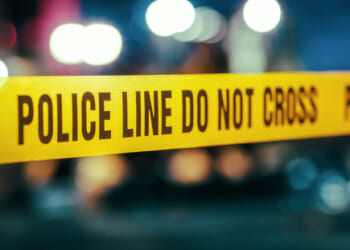Police tape can be viewed ahead of a crime scene.