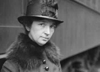 Margaret Sanger is pictured standing near a train in Chicago circa 1917.