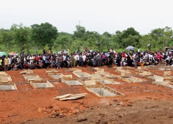 The graves of 17 Christian worshippers and two priests who were murdered by Fulani herdsmen sit open in north-central Nigeria on May 22, 2018.