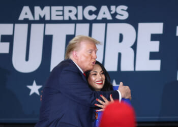 Donald Trump, with candidate for US Representative Mayra Flores (R), departs after a roundtable with Latino leaders at Beauty Society Inc., in North Las Vegas.