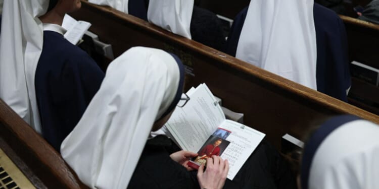 Nuns sit in church pews in St. Patrick’s Cathedral on February 5, 2026.