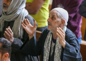 Coptic Christians in worship at a Palm Sunday service in Cairo, Egypt on April 5, 2026.