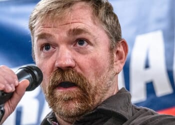 Then-Maine Democratic Senate candidate Graham Platner is pictured in a June 7 file photo speaking in Portland.