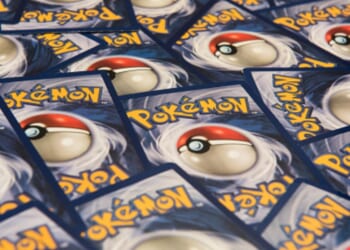 Pokémon Cards lay on a table.