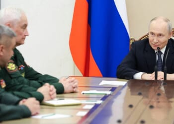 Russian President Vladimir Putin meets with Russian Defense Ministry leadership Wednesday in a photo distributed by the Russian state agency Sputnik.