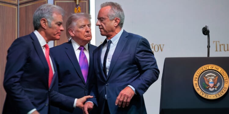Centers for Medicare & Medicaid Services Administrator Mehmet Oz, President Donald Trump, and Health and Human Services Secretary Robert F. Kennedy Jr. hold a news conference about the government prescription drug program TrumpRx.gov in the Eisenhower Executive Office Building on May 18, 2026, in Washington, D.C.