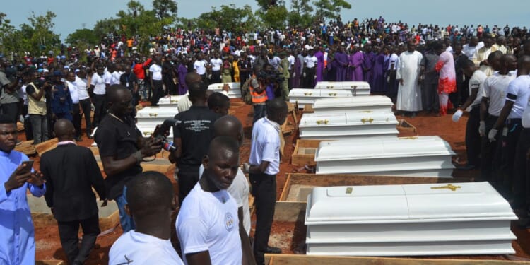 Coffins are prepared for a funeral service for 17 worshippers and two priests in Nigeria who were believed to have been killed by Fulani herdsmen in Benue State, north-central Nigeria on May 22, 2018.