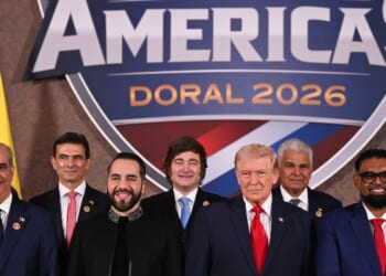President Donald Trump stands with foreign leaders during a group photograph at the start of the Shield of the Americas Summit at the Trump National Doral Golf Club on March 7, 2026, in Doral, Florida.