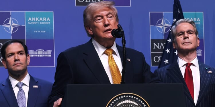President Donald Trump, with Secretary of State Marco Rubio, left, and Treasury Secretary Scott Bessent, right, speaks in a July 8 file photo from the NATO summit in Ankara, Turkety.
