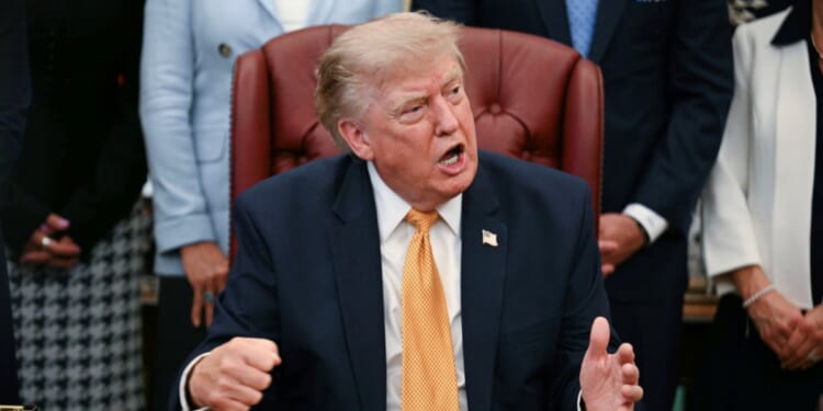 President Donald Trump speaks after signing an executive order in the Oval Office of the White House in Washington, D.C., on Aug. 3, 2026.
