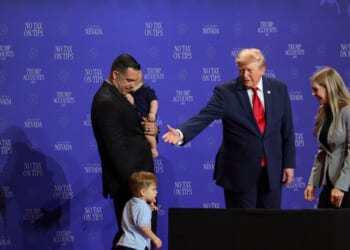 President Donald Trump introduces a family who has benefitted from the "no tax on tips" policy onstage during an event at Red Rock Casino Resort and Spa on Aug. 5, 2026, in Las Vegas, Nevada.