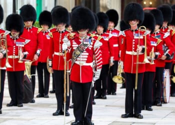 The Band of the Coldstream Guards, seen in front of Buckingham Palace in a 2024 photo, played a tribute to Dolly Parton Wednesday.