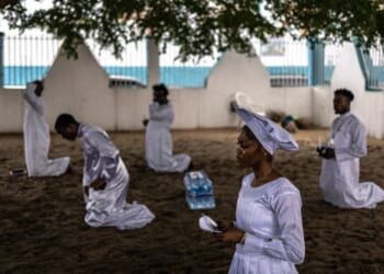 Christians kneel in worship on July 12, 2026 in the Ketu neighborhood of Lagos.