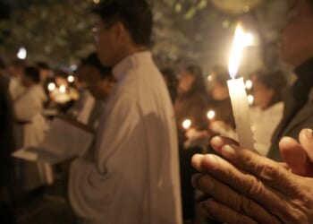 Vietnamese Catholic Christians pray in public in Hanoi, Vietnam, on Jan. 5, 2008.