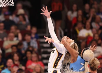 Sophie Cunningham of the Indiana Fever is fouled by DiJonai Carrington of the Chicago Sky during the first half at United Center on Aug. 8, 2026, in Chicago, Illinois.