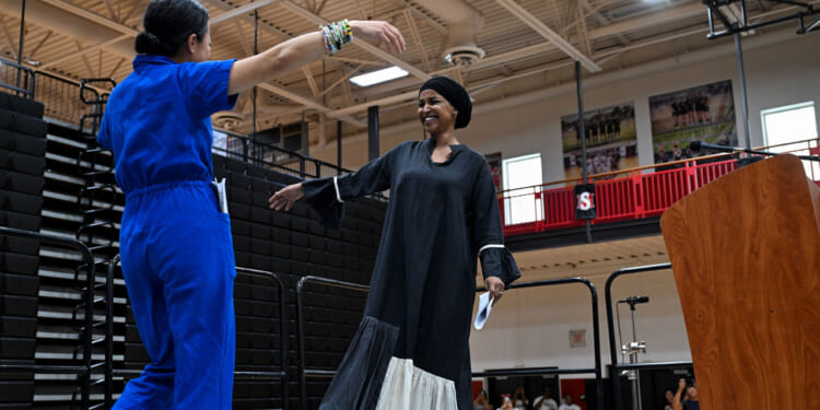 Wisconsin gubernatorial candidate Francesca Hong greets Rep. Ilhan Omar.