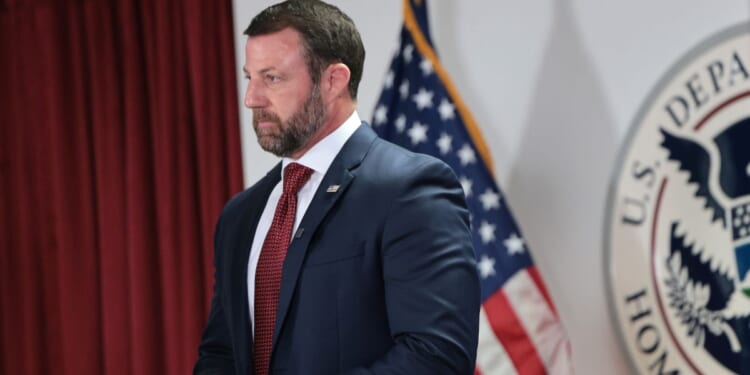 Secretary of Homeland Security Markwayne Mullin stands silently during a press conference at the US Citizenship and Immigration Services field office on Sept. 1, 2026, in New York City.